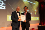 Tony Gray, former CEO of TCCA, presenting the ICCA award to Hytera representative (on the right) (Photo: Business Wire)