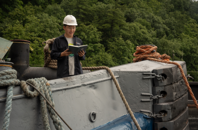 Seonghoon Woo, CEO at Amogy, reads to Poseidon as a part of the renaming ceremony. (Photo: Business Wire)