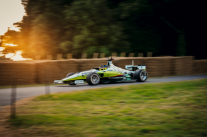 The world’s fastest autonomous racecar with an AI pilot coded by students from PoliMOVE-MSU team races on Goodwood Hill. Credit Indy Autonomous Challenge. (Photo: Business Wire)