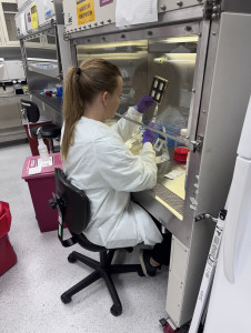 Rachel Nordberg, PhD, from the DELTAi Lab at UC Irvine, prepping the BioServe device before it goes into orbit.