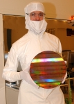 Intel? engineer holding 300 mm wafer with 45 nm shuttle test chips
