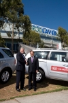 Mr SK Lee, President and CEO of Kia Motors Australia, (right) presents the official key for the Kia 