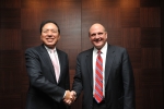 Yoon-Woo Lee (Left), Vice Chairman and CEO, Samsung Electronics shakes hands with Steve Ballmer, CEO