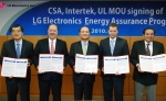(From Left): Dr. Woo Paik, LG Electronics President and Chief Technology Officer/ Keith E. Williams,
