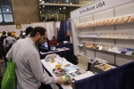 An attendee is browsing a book at Book Expo America on May 24, 2011.