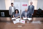 Anna Roy of NITI Aayog and Sanjeev Sharma, managing director of ABB India, sign a statement of partn