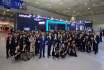 Officials from Siemens Korea and participants pose for a photo at an exhibition at ‘Smart Factory+Au
