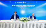 From left to right: Timur Turlov, CEO of Freedom Holding Corp., Leiming Chen, Senior Vice President 