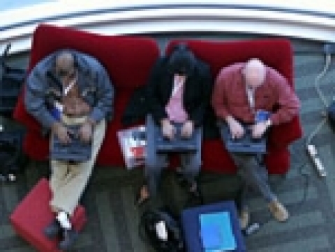 Attendees enjoy a break in the proceedings to catch-up online at the Intel Developer Forum, the tech