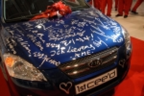 The first production cee’d is covered with commemorative signatures from various VIPs.