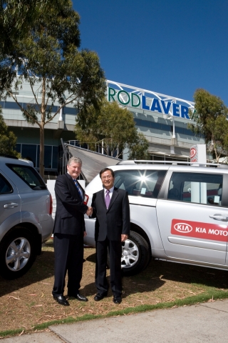 Mr SK Lee, President and CEO of Kia Motors Australia, (right) presents the official key for the Kia courtesy fleet for the 2008 Australian Open to Mr Geoff Pollard, President of Tennis Australia, (left) outside Rod Laver Arena in Melbourne.