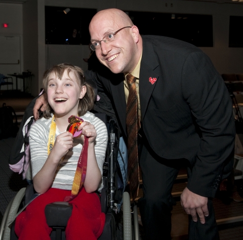 Samsung's Paralympic Athlete Ambassador Jean Labonté signs autographs and shows off his Torino 2006 Paralympic Games gold medal to lucky Kurstyn Froud following the official announcement of Samsung as a Worldwide Paralympic Partner of the International Paralympic Committee and an Official Sponsor of the Vancouver 2010 Paralympic Winter Games.