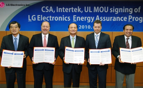 (From Left): Dr. Woo Paik, LG Electronics President and Chief Technology Officer/ Keith E. Williams,