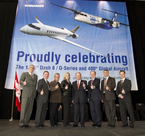 The platform party gives a "thumbs up" to the Dash 8/Q-Series turboprop and Global business jet programs.