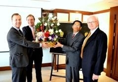 (l to r) Mr. Rob van Staten and Mr. Sebe Gerritsen of BWise receive a congratulatory flower basket from Mr. Khun Danai Wangsiri, Vice President of FSI and Mr. Joseph Fincher, Head Solution Management Organization at YIT as celebration of the opening of the BWise Thai office.