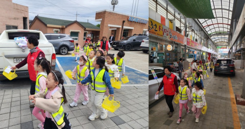 오천시장에서 어린이들이 상인 선생님과 함께 즐겁게 전통시장 장보기 체험을 하고 있다