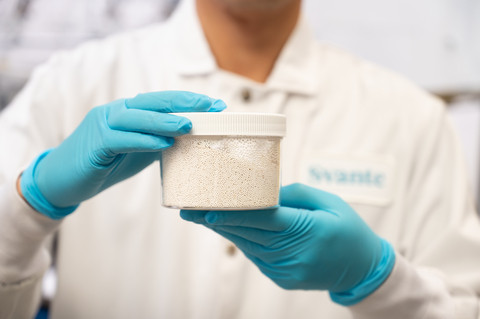 Svante scientist holding a jar of metal-organic framework (MOF), a relatively new class of nanomater