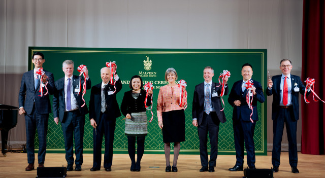 Officiating guests (from left to right) perform the ribbon cutting ceremony at Malvern College Tokyo...