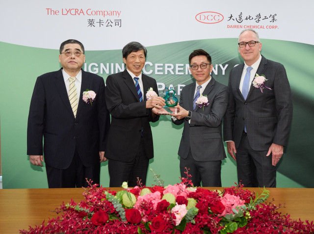 The LYCRA Company presents the Green Partner Award to DCC. (l. to r.) Shean-Tung Lin of DCC; Fu-Chu ...