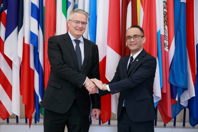 OECD Secretary-General Mathias Cormann (L) and APO Secretary-General Dr. Indra (R) (Photo: Business ...