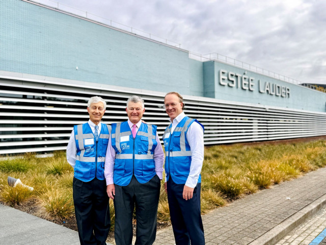 Gary Lauder, Board of Directors; William P. Lauder, Chair, Board of Directors, The Estée Lauder Companies; and Stéphane de La Faverie, President and Chief Executive Officer, outside the original Oevel manufacturing facility