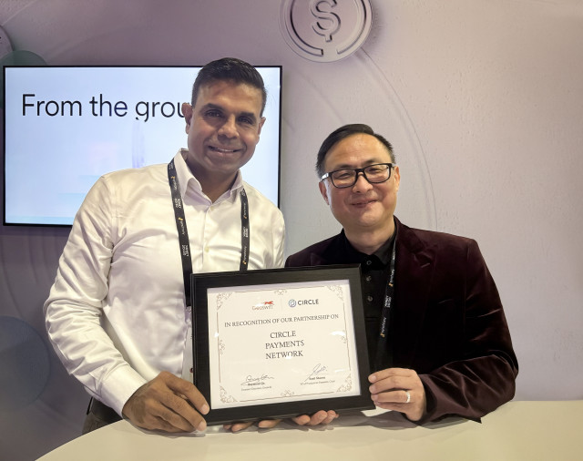 Raymond Qu, Group CEO and founder of Geoswift, and Sunil Sharma, VP Product Management at Circle, celebrating the partnership in Las Vegas.