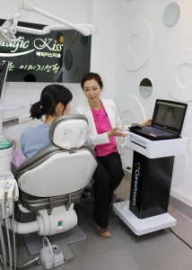 Dr. Yumi Jung is explaining gum and mouth conditio