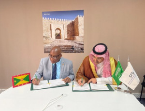 SFD CEO, H.E. Sultan Al-Marshad, and Minister of Finance of Grenada, Hon. Dennis Cornwall, signed th