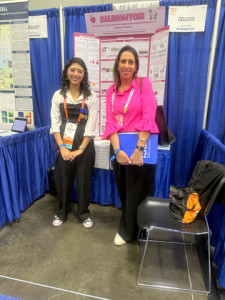 Kristin Dasaro, Director, Package Engineering and Sustainability at Mary Kay, greets Brazilian cancer researcher, Carolina de Araujo Pereira da Silva, who received back-to-back awards from Mary Kay for innovative findings in the malignancy of tumors. (Photo Credit: Mary Kay Inc.)