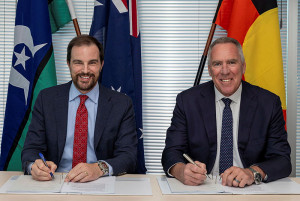 Assistant Secretary Space Systems Branch, Michael Hunt, formalizes contract negotiations for the through-life support of the IS-22 satellite with Rory Welch, senior vice-president of service delivery at SES Space and Defense. Photos: Corporal Annika Smit