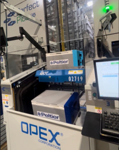 OPEX iBOTs efficiently transport and present Peltier chilled (light blue) and frozen (dark blue) totes at the pick station of the Perfect Pick ASRS.